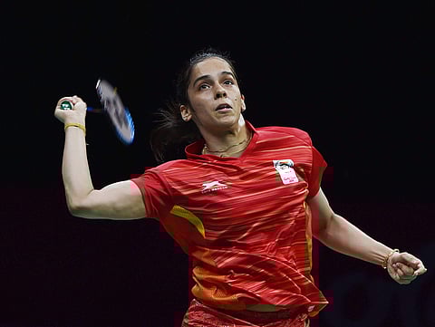 India's Saina Nehwal returns a shot to Singapore's Jia Min Yeo during the women's singles of Badminton Mixed Team semifinals match | PTI