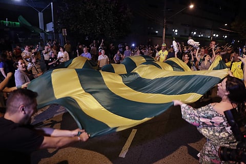 Demonstrators protest outside the federal police headquarters in Sao Paulo, Brazil, Saturday, April 7, 2018 after former President Luiz Inacio Lula da Silva arrived. | AP