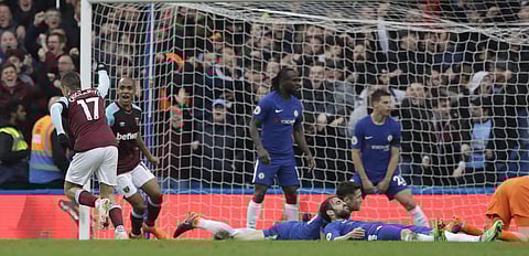 West Hams's Javier Hernandez, left, celebrates after scoring goal during the English Premier League soccer match between Chelsea and West Ham United at Stamford Bridge stadium in London, Sunday, April 8, 2018. | AP