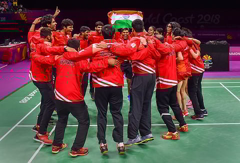 Indian badminton team hold the tricolour as they celebrate India's win in mixed-team badminton event final at Gold Coast | PTI