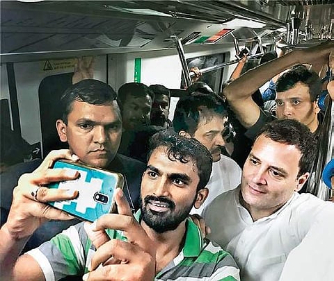 Congress president Rahul Gandhi poses for a selfie with a commuter on the Metro in Bengaluru on Sunday | PTI