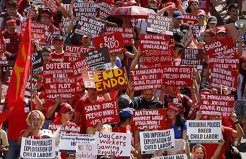 Protesters, mostly workers, march towards the Presidential Palace during the global commemoration of Labor Day Tuesday, May 1, 2018 in Manila, Philippines.