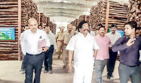 Forest Minister Sidda Raghava Rao inspecting the central red sanders godown in Tirupati on Monday  | Express