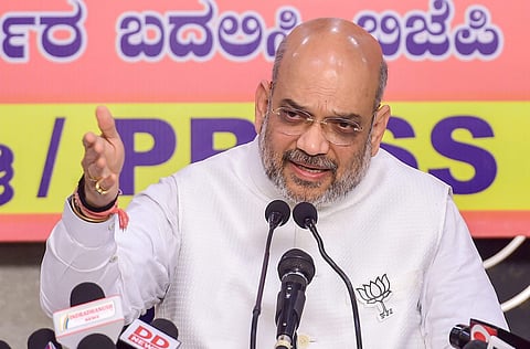 BJP National President Amit Shah addresses a press conference ahead of Karnataka Assembly election 2018 in Bengaluru on Thursday. | PTI