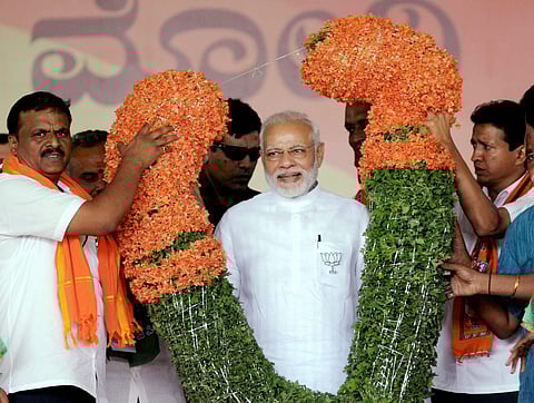 Prime Minister Narendra Modi gestures as he speaks during a public rally ahead of the Karnataka Assembly Election 2018 on Saturday. | PTI File Photo