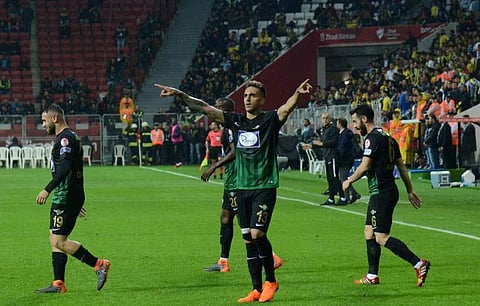 Akhisar's Miguel Lopez (C) celebrates after scoring a goal during The Ziraat Turkish Cup final football match between Fenerbahce and Akhisar in Diyarbakir. (AFP)