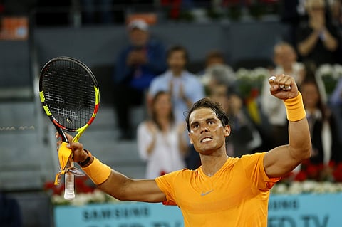 Rafael Nadal from Spain celebrates his victory over Diego Schwartzman from Argentina during a Madrid Open tennis tournament match in Madrid. (AP)