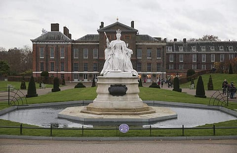 In this file photo taken on November 27, 2017 A marble statue of Britain's Queen Victoria is pictured in the gardens of Kensington Palace in west London. | AFP