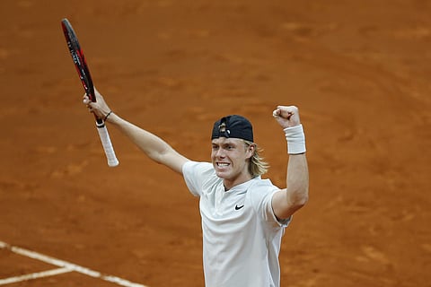 Denis Shapovalov of Canada celebrates defeating Kyle Edmund of Britain 7-5, 6-7, 6-4 during the Madrid Open Tennis tournament in Madrid. (AP)