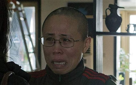 Despite the daily restrictions and surveillance faced by Liu Xia, Chinese authorities still maintain she is free. | AP