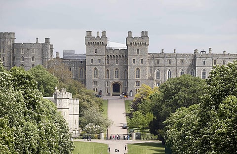 A view of Windsor Castle in Windsor, England, Friday, May 11, 2018. All roads seem to lead to Windsor Castle, a magnificent fortress perched high on a hill topped by the royal standard when the queen is in residence. It is here — a favoured royal playground since William the Conqueror built the first structure here in 1070 — that the royal wedding of Prince Harry and Meghan Markle will take place. (Photo | AP)