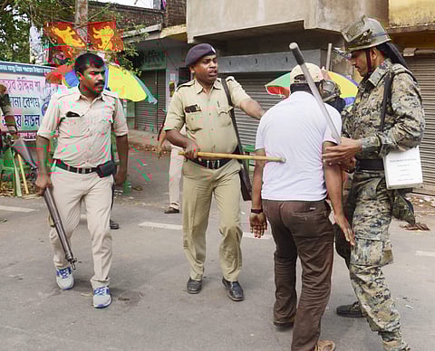 Security personnel lathi charged on political party workers who were allegedly involved in ransacking a polling booth and public property during Panchayat elections at a village in Howrah district of West Bengal on Monday. (PTI)