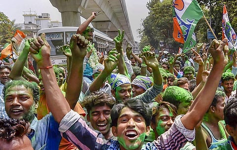 All India Trinamool Congress supporters celebrate during Panchayat poll election results outside the counting station in North 24 Parganas on Thursday. | PTI