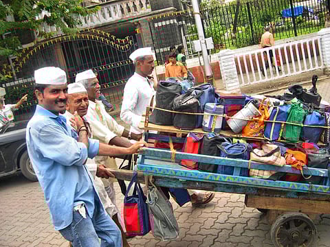 The dabbawalas ferry tiffins of home-cooked food to thousands of office-goers in the city every day. (Photo | Wikimedia Commons/Joe Zachs)