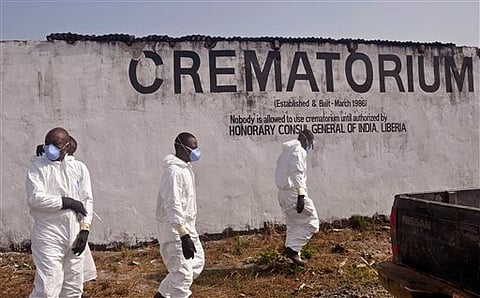 Health workers prepare to collect the ashes of people that died due to the Ebola virus at a crematorium on the outskirts of Monrovia, Liberia. |File Photo: AP
