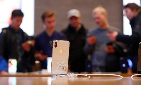 People look at iPhone X during its launch at the Apple store in Berlin. | Reuters