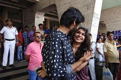 A man and a woman hug in protest at Tollygunge metro station on Wednesday. | EPS