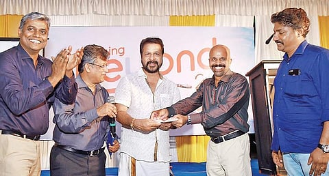 KCA president Ronklin John, secretary Jayesh George and treasurer Adv Sreejith V Nair hand over a cheque to Tripunithura Cricket Club secretary Biju John and president C P Prathapan