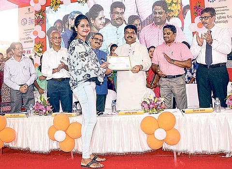 Union Petroleum Minister Dharmendra Pradhan felicitating a student at the foundation day of Skill Development Institute in Bhubaneswar on Sunday | Express