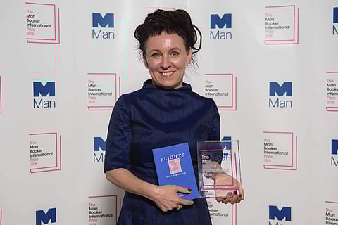 Polish author Olga Tokarczuk smiles after winning the Man Booker International prize 2018, Tuesday, May 22, 2018, for her book Flights, at the Victoria and Albert Museum in London. (AP)