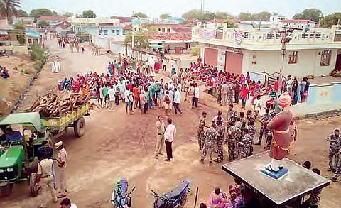 Police force deployed after a tribal youth was beaten up by villagers, in Chengal village of Nizamabad, on Wednesday | Express photo