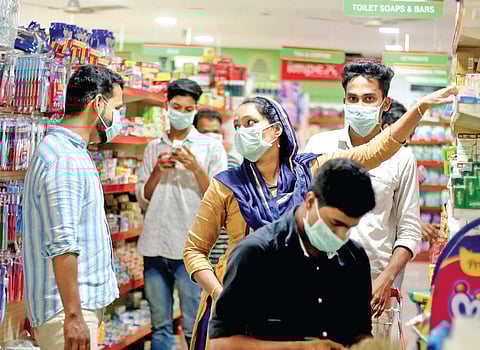 People wear masks to keep the Nipah virus at bay while shopping at a supermarket at Perambra in Kozhikode (Photo | T P Sooraj)
