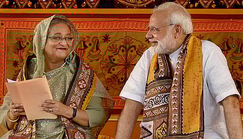 Prime Minister Narendra Modi speaks with his Bangladeshi counterpart Sheikh Hasina during the annual convocation of Visva Bharati University in Birbhum on Friday. (PTI Photo)