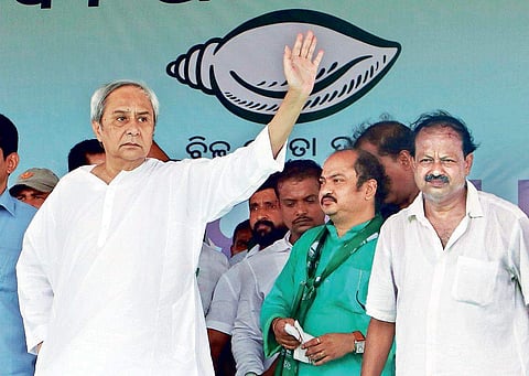 CM Naveen Patnaik waves to the crowd as other BJD leaders look on during the concluding day of ‘Mahanadi Suraksha Abhiyan’ at Paradip on Friday | Express