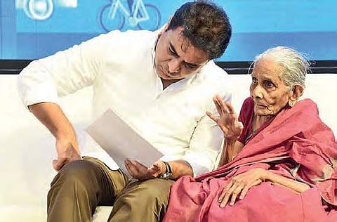 Minister KT Rama Rao interacts with an 85-year-old woman during the Mana Nagaram programme at Nizampet, Hyderabad on Friday   | Express