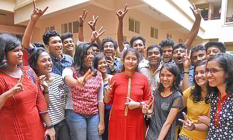 Students celebrating at Saraswati Vidyalaya at Vattiyoorkavu after the class 12 CBSE results came on Saturday. | Express photo