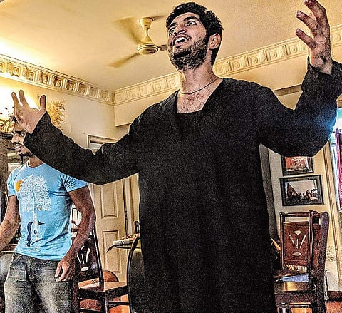 An actor reherses for A Matter of Life and Death that will be staged on June 2