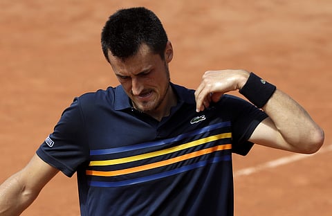 Australia's Bernard Tomic reacts as he plays Argentina's Marco Trungelliti during their first round match of the French Open | AP