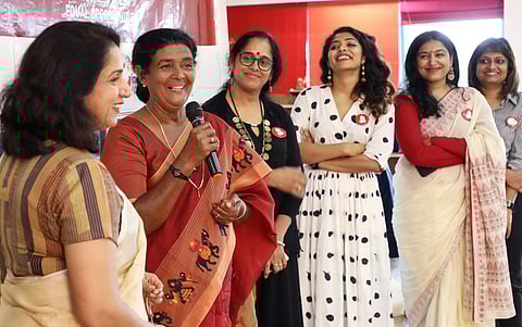 Actor Pauly Valsan speaking during the first anniversary celebration of the Women In Cinema Collective in Kochi on Sunday. Also seen are Revathy, Rima Kallingal, Padmapriya and Geethu Mohan Das. (Express Photo | Melton Antony)
