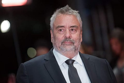 In this file photo taken on February 17, 2018 French director Luc Besson poses on the red carpet upon arrival for the premiere of the film 'Eva' presented in competition during the 68th Berlinale film festival in Berlin. | AFP