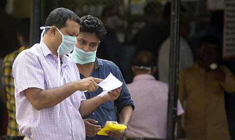 With Nipah virus cases being reported, people are spotted wearing masks in Kerala. (Express Photo | Manu R Mavelil)