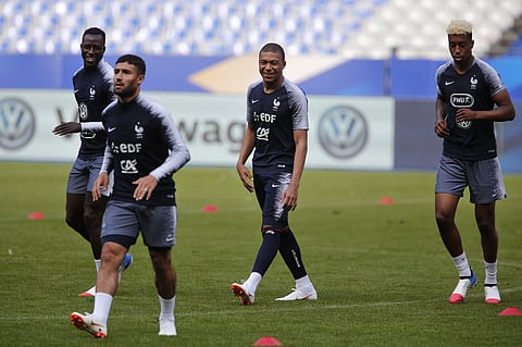 France's Benjamin Mendy (L) with Kylian Mbappe (C) and Presnel Kimpembe.