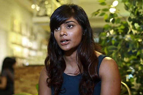 Grace Nathan, whose mother Anne Daisy was on board the missing Malaysia Airlines MH370, talks to journalists at a restaurant in Kuala Lumpur, Malaysia, Tuesday, May 29, 2018. | AP