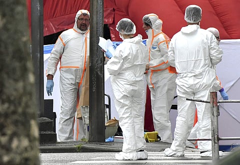 Forensic police work at the scene of a shooting in Liege, Belgium, Tuesday, May 29, 2018. | AP