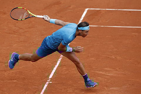 Rafael Nadal runs to return a shot against Simone Bolelli during their first round match of the French Open | AP