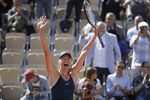 Russia's Maria Sharapova celebrates winning her first round match of the French Open tennis tournament against Netherland's Richel Hogenkamp | AP