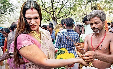 A priest breaking the bangles of a transgender at the Koovagam festival on Friday | G PATTABIRAMAN