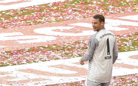 FILE - In this Saturday, May 12, 2018 file photo, Bayern goalkeeper Manuel Neuer celebrates with his team the 28th Bundesliga title in Munich.  | AP