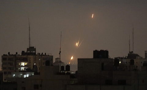Flames of rockets fired by Palestinian militants are seen over Gaza Strip toward Israeli lands, early Wednesday, May 30, 2018. | Associated Press