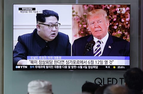 FILE - In this May 26, 2018, file photo, people watch a TV screen showing file footage of U.S. President Donald Trump, right, and North Korean leader Kim Jong Un during a news program at the Seoul Railway Station in Seoul, South Korea. | AP