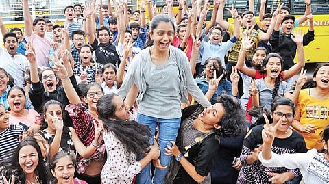 Students celebrate their success in CBSE Class 10 examinations after the declaration of results in Bengaluru.
