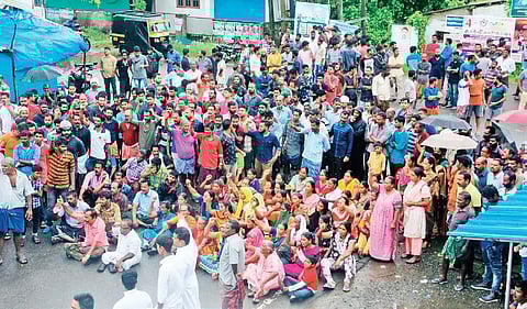 People blocking the road as part of the hartal demanding building of a seawall at Kandajadavu Junction at Chellanam on Tuesday | Melton Antony