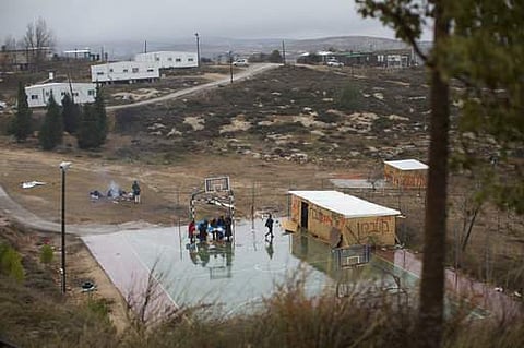 Jewish settlers in a basketball field in Amona, an unauthorized Israeli outpost in the West Bank, east of the Palestinian town of Ramallah. (File | AP)