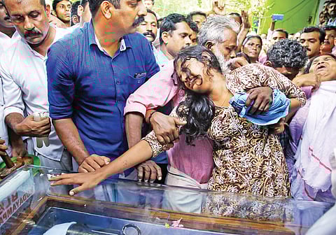 Kevin Joseph’s father Joseph Jacob trying to console Kevin’s wife Neenu when the mortal remains were brought to Platharayil house on Tuesday | Vishnu Prathap