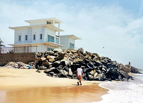 Seawall being constructed by owners of beach-facing luxury bungalows to protect the houses from sea erosion in Muttukadu | shiba prasad sahu