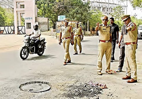 Malkajgiri DCP Ch R Umamaheswara Sarma and Uppal inspector P Venkateshwarlu inspecting the spot where the two workers died on Wednesday.| Vinay Madapu